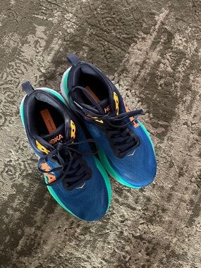 Hoka Bondi women’s Blue Running Sneakers with Teal Soles and Orange Accents